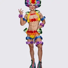 Rainbow Carnival Queen Brisbane QLD drag queen Tara Zaan posing in a vibrant rainbow carnival costume with colourful flowers, statement headpiece and platform heels.