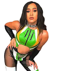 Drag Queen Moesha posing with a sultry look on her face, she is in a lycra green, yellow and white outfit with black gloves. She is looking stunning and has long black hair.