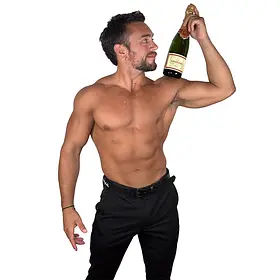 A fit, muscular topless waiter for a Sydney hens party posing with a bottle of Grandin champagne balanced on his shoulder. He provides premium male hosting, bubbly service, and entertainment for bachelorette parties and bridal showers across Sydney, NSW.