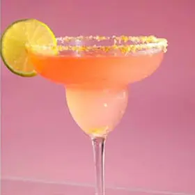 Pink tequila margarita cocktail dirty martini in glass with salted rim and citrus garnish, styled for hens party cocktail making activity
