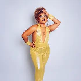 Karna Ford Gold Jumpsuit Look Sydney drag queen Karna Ford wearing a shimmering gold jumpsuit during a professional studio photoshoot.
