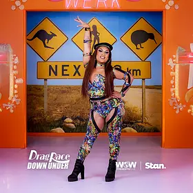 Karna Ford Drag Race Down Under Sydney drag queen Karna Ford posing on the Drag Race Down Under set in a colourful performance outfit.